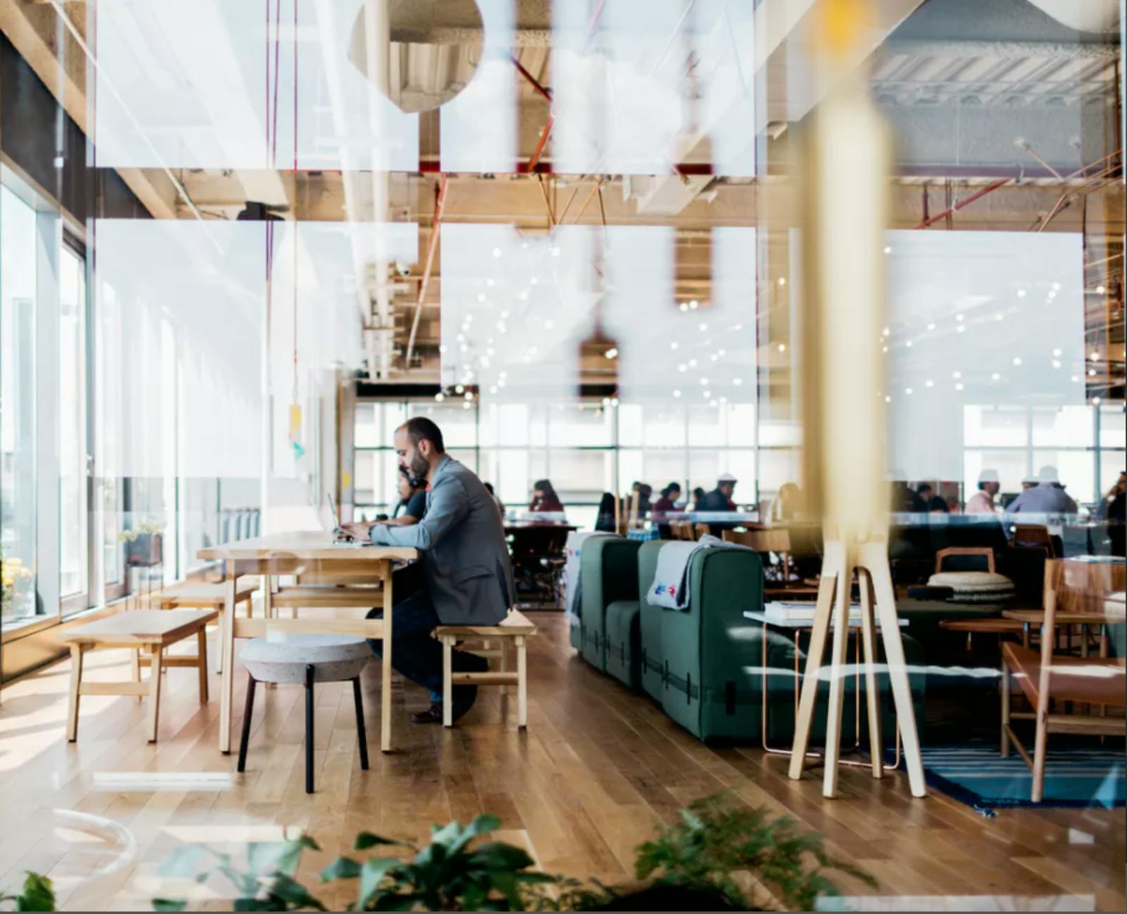 Bright open concept coworking space with people quietly working