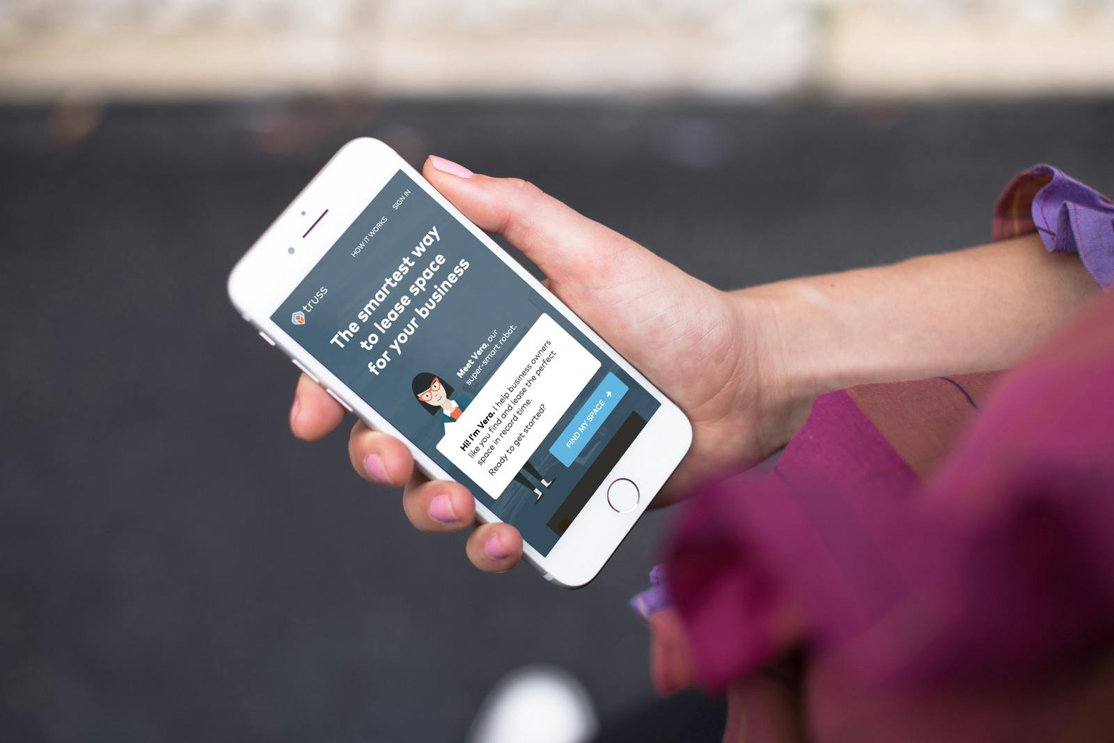 Person browsing for office space on their phone using the Truss marketplace